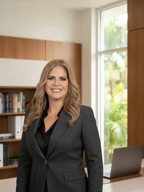 Yanila Ortiz, CPA, principal of Ortiz-Méndez, CPA, standing in her office